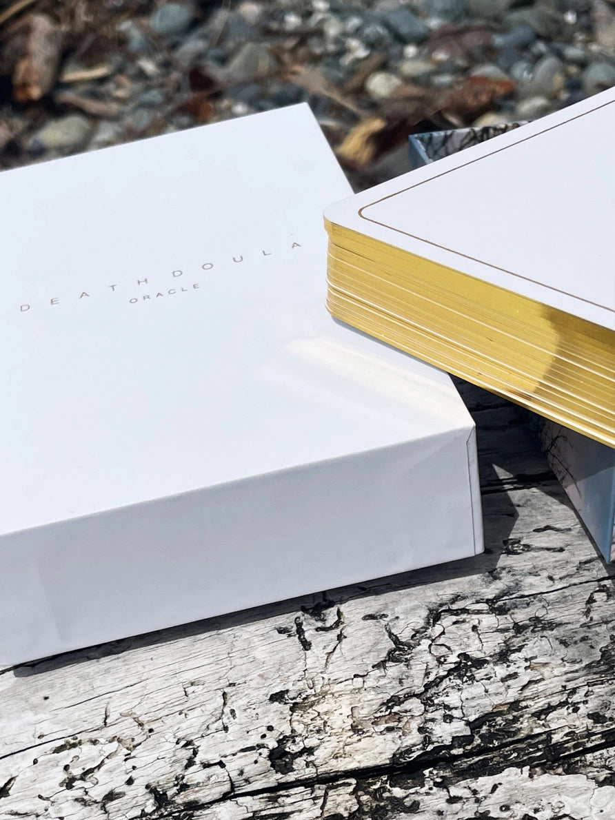Two books on a wooden surface with a natural background