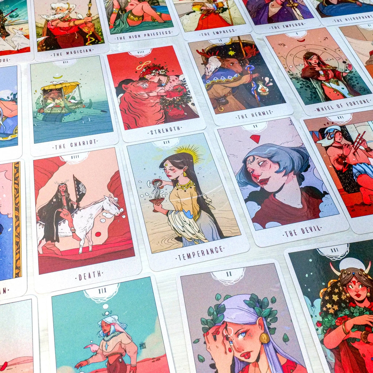 Collection of tarot cards with colorful illustrations and text