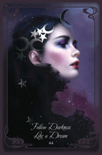 Artistic depiction of a woman with celestial accessories on a dark background with text 'Follow Darkness Like a Dream'.