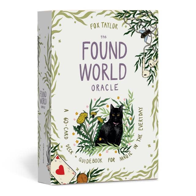 Box of 'The Found World Oracle' with a black cat illustration on a white background
