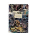 Notebook with a cosmic landscape design on the cover