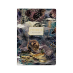 Notebook with a cosmic landscape design on the cover