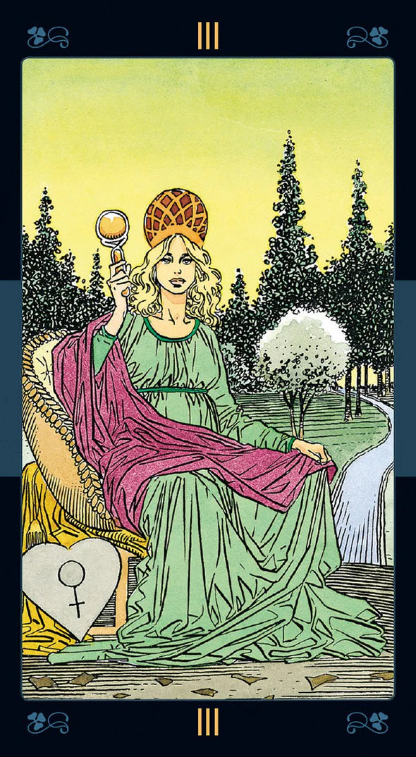 Tarot card featuring a figure in a green dress with a purple cloak, holding a mirror, in a forest setting.