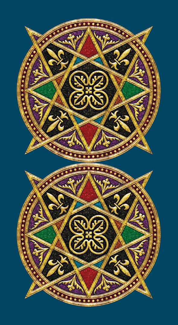 Two decorative emblems with geometric patterns and symbols on a blue background. This is the back side of the Universal Tarot cards.