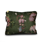 Floral patterned pillow with a vase and bird design on a green background