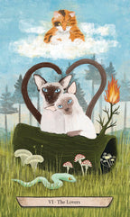Two cats in a heart-shaped chair with nature elements on a card labeled 'The Lovers'.