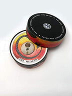 Colorful lip balm container with 'The Healer' text on a white background