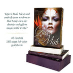 Book titled 'The Queen Mab Oracle' with a face on the cover, displayed on a stand.