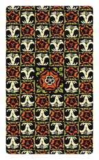 Patterned fabric with red, black, and white floral design on a green background