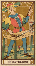 Card from a tarot deck featuring a figure with a hat and a staff, standing behind a table with a compass and other objects.