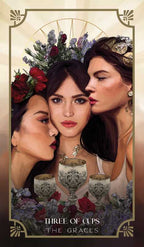 Three women with floral crowns and cups, styled like a tarot card titled 'Three of Cups: The Graces'.