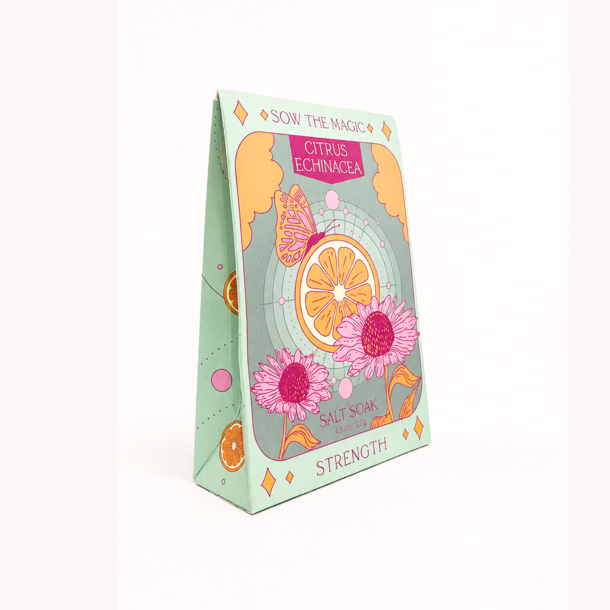 A standing triangular box of SOW THE MAGIC salt soap, Citrus Echinacea Strength, featuring a pastel mint green cover decorated with pink echinacea flowers, an orange slice, and a butterfly.