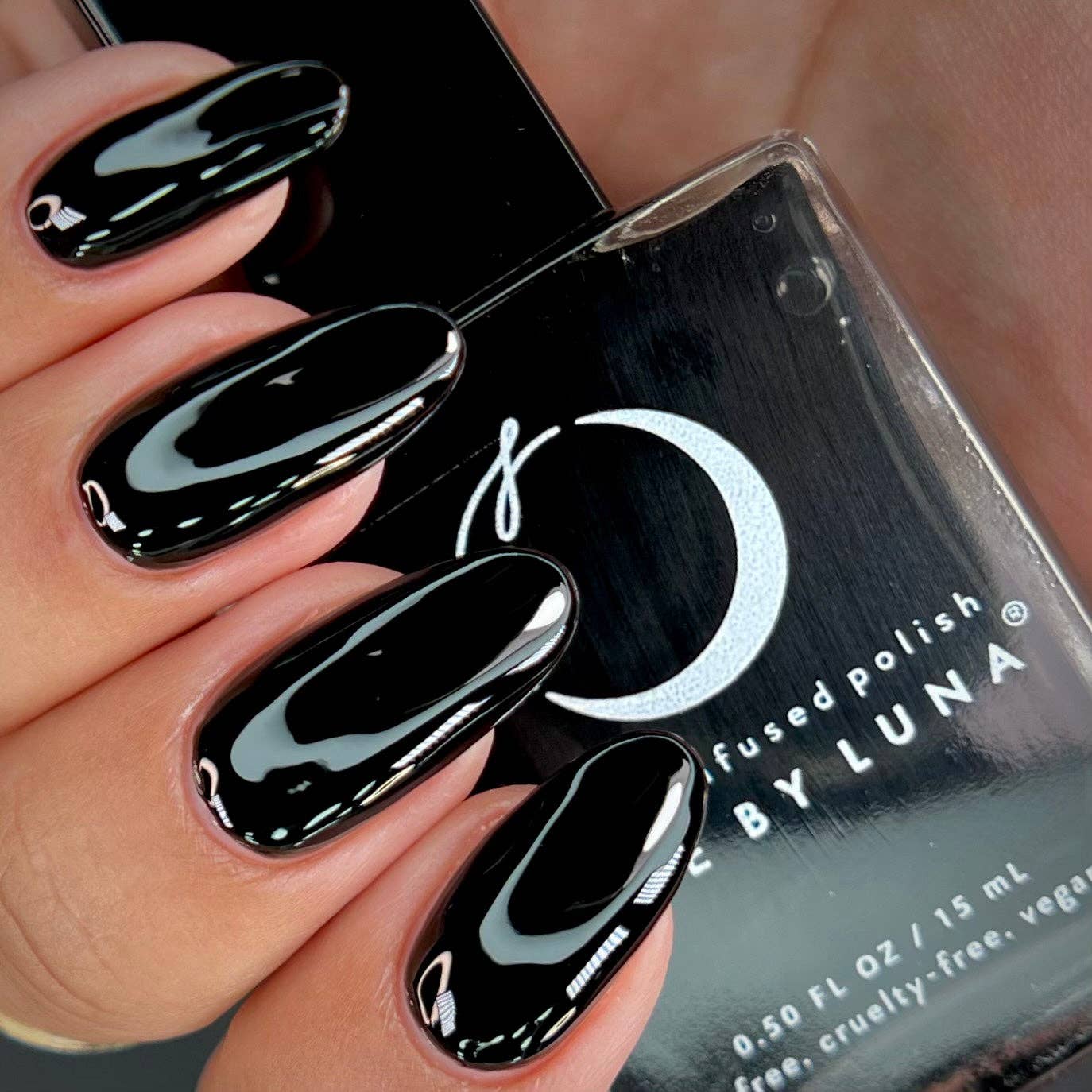Black nail polish with Luna nail polish bottle