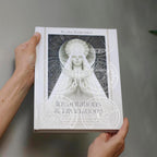 Book titled 'Incentivations & Divinations' by Alana Fairchild held by a person against a neutral background
