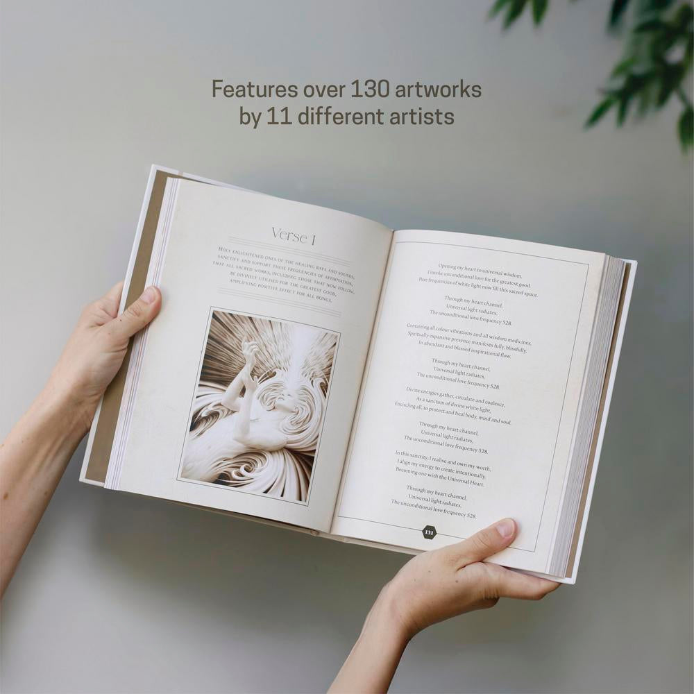 Open book held by a person with text about artworks on a neutral background