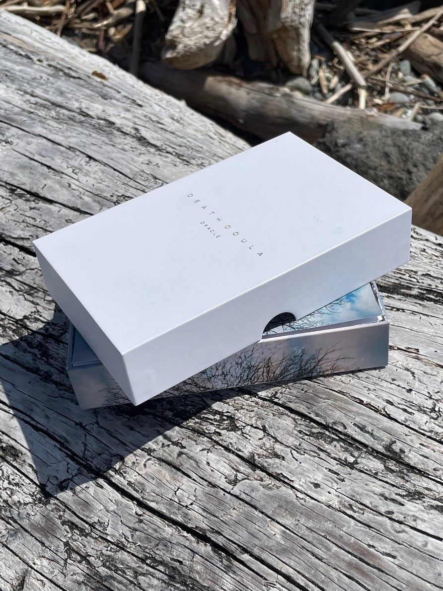 White rectangular box on a wooden surface with natural background
