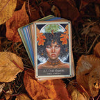 Card featuring a woman with a crown of leaves on a background of autumn leaves