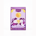 A rectangular box of 'Sow the Magic: Lavender' salt soak by 'The Moon' on a clean white background. The packaging features a lavender-purple background with a yellow sun, white and purple flowers, and gold decorative accents.