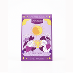 A rectangular box of 'Sow the Magic: Lavender' salt soak by 'The Moon' on a clean white background. The packaging features a lavender-purple background with a yellow sun, white and purple flowers, and gold decorative accents.
