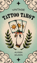Book cover of 'Vintage Tattoo Tarot' by Alyssa Wilson with a hand holding cards design.