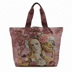 Tote bag with a decorative design of a woman's face and floral elements on a pink background.