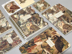 Collection of notebooks with owl designs on a gray surface