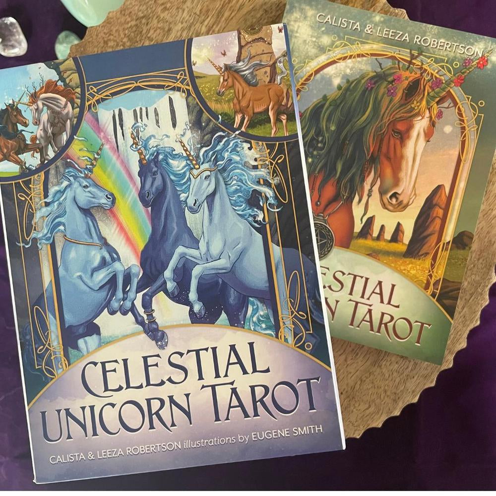 Two tarot card books titled 'Celestial Unicorn Tarot' and 'Aststial Tarot' on a purple surface.