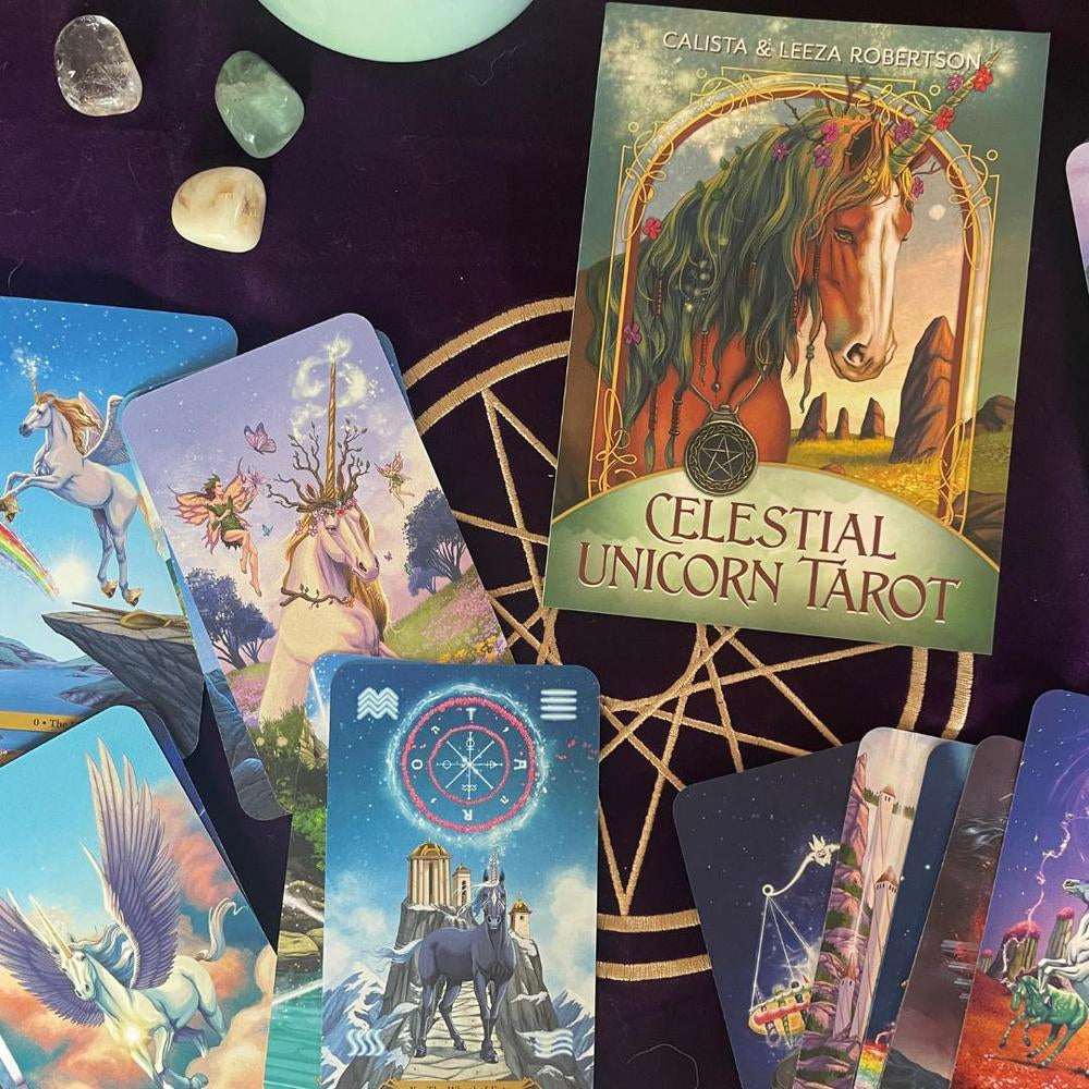 Collection of 'Celestial Unicorn Tarot' cards with a prominent card showing a unicorn and text.