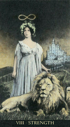 Tarot card titled 'Strength' featuring a woman in a white dress with a lion and a castle in the background.