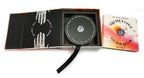 Open book with a black circular object and 'Archetypes Guidebook' on a white background