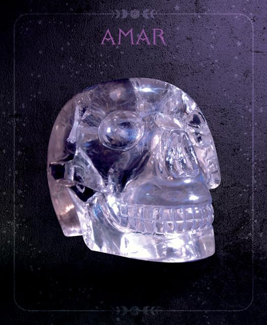 Clear crystal skull on a dark background with 'AMAR' branding.