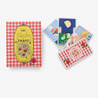 Pasta Tarot card set with a red and white checkered box and tarot cards featuring illustrations of pasta dishes.