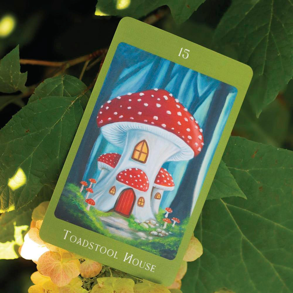 Card with a mushroom house illustration on green leaves