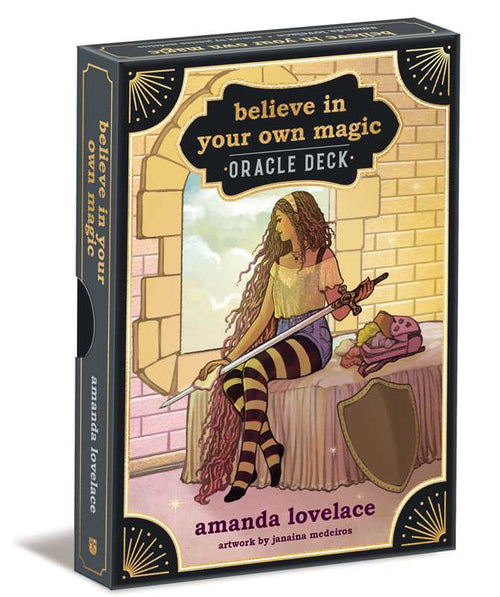 Oracle deck packaging with a woman sitting by a window, text 'believe in your own magic' and 'Amanda Lovelace'.