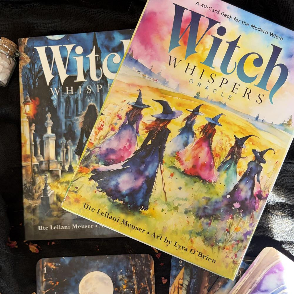 Two books titled 'Witch Whisper' and 'Witch' on a wooden surface.
