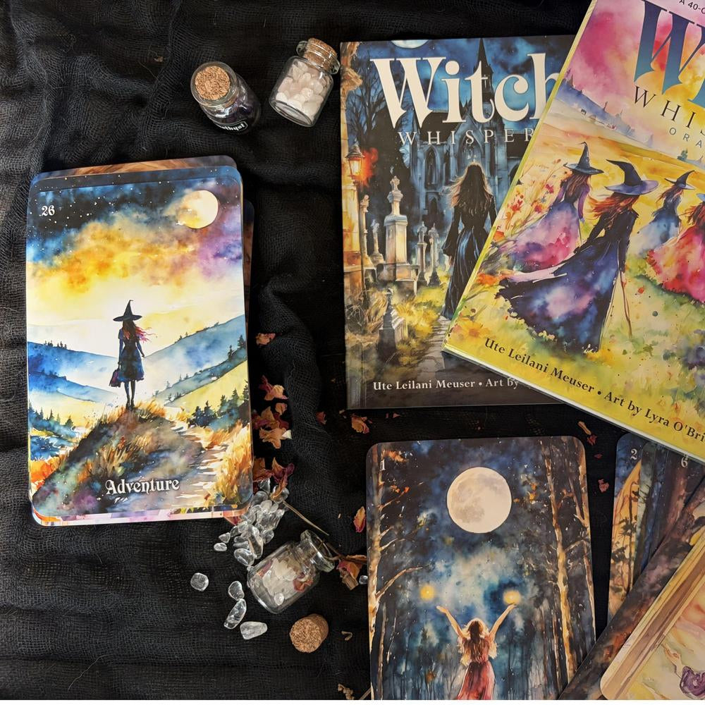 Collection of tarot cards and mystical items on a dark surface