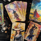 Set of tarot cards featuring artistic illustrations of women in witch hats on a dark surface.