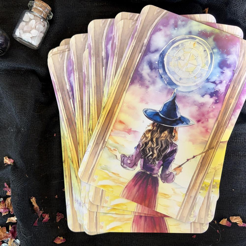 Set of tarot cards with a witch and moon design on a dark background