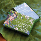 Enchanted Garden Oracle card set on a green leafy background