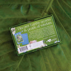 Card game box titled 'Discover Earth's secrets & pearls of wisdom' on a green leafy background
