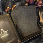 Decorative box with a ghost design on a dark background