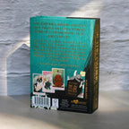 Book titled 'Ask the Canine Sages' with text and images on a textured surface