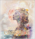 A 2027 Gratitude Diary & Daily Planner cover featuring a double-exposure portrait of a woman's profile with a glowing moon, stars, leaves, and small decorative elements. Large gold text reads '2027 GRATITUDE' with 'DIARY & DAILY PLANNER' below on a soft pastel background.