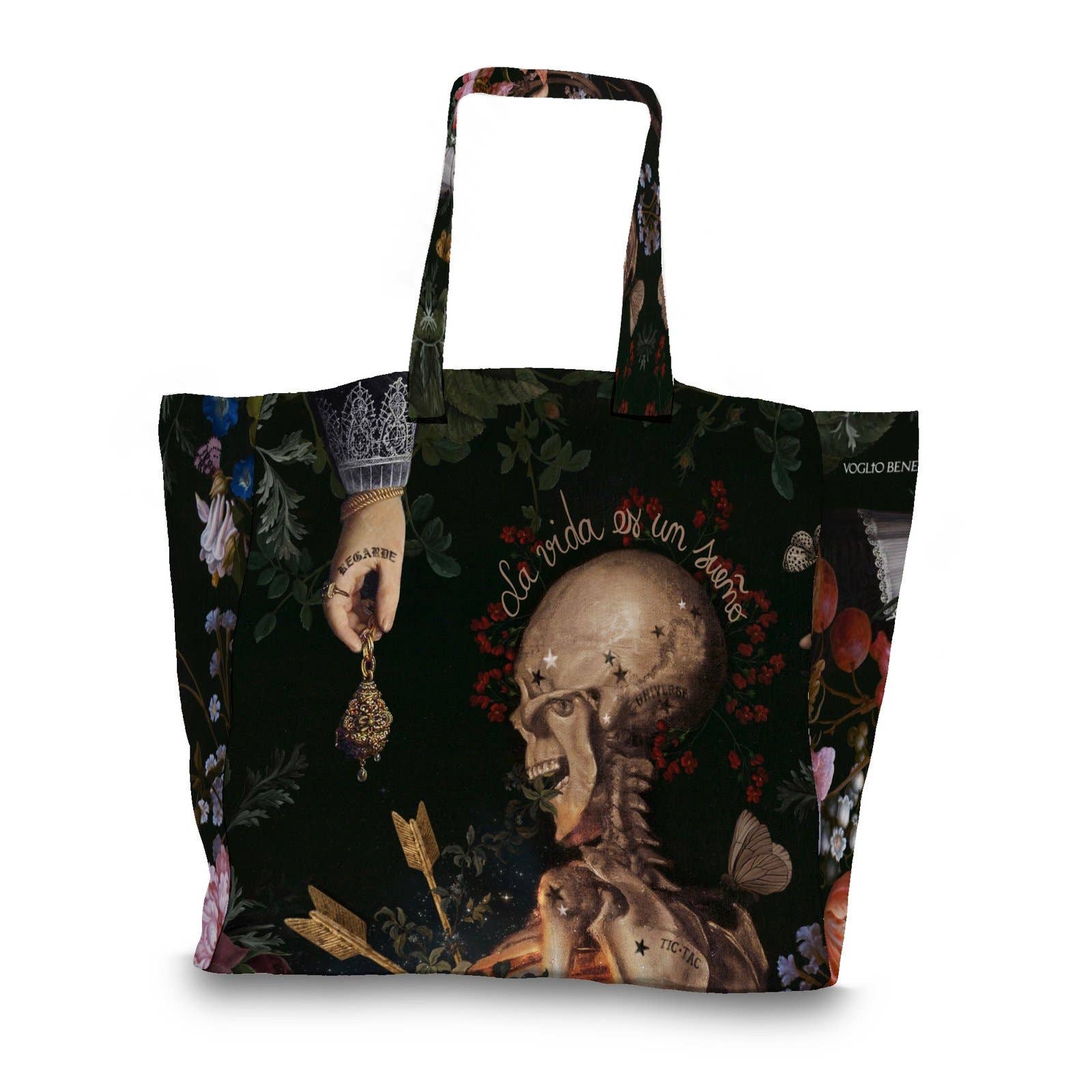 A black tote bag featuring a detailed gothic illustration of a skull, a hand holding a candle, floral elements, and the text 'La vida es un sueño' on a white background.