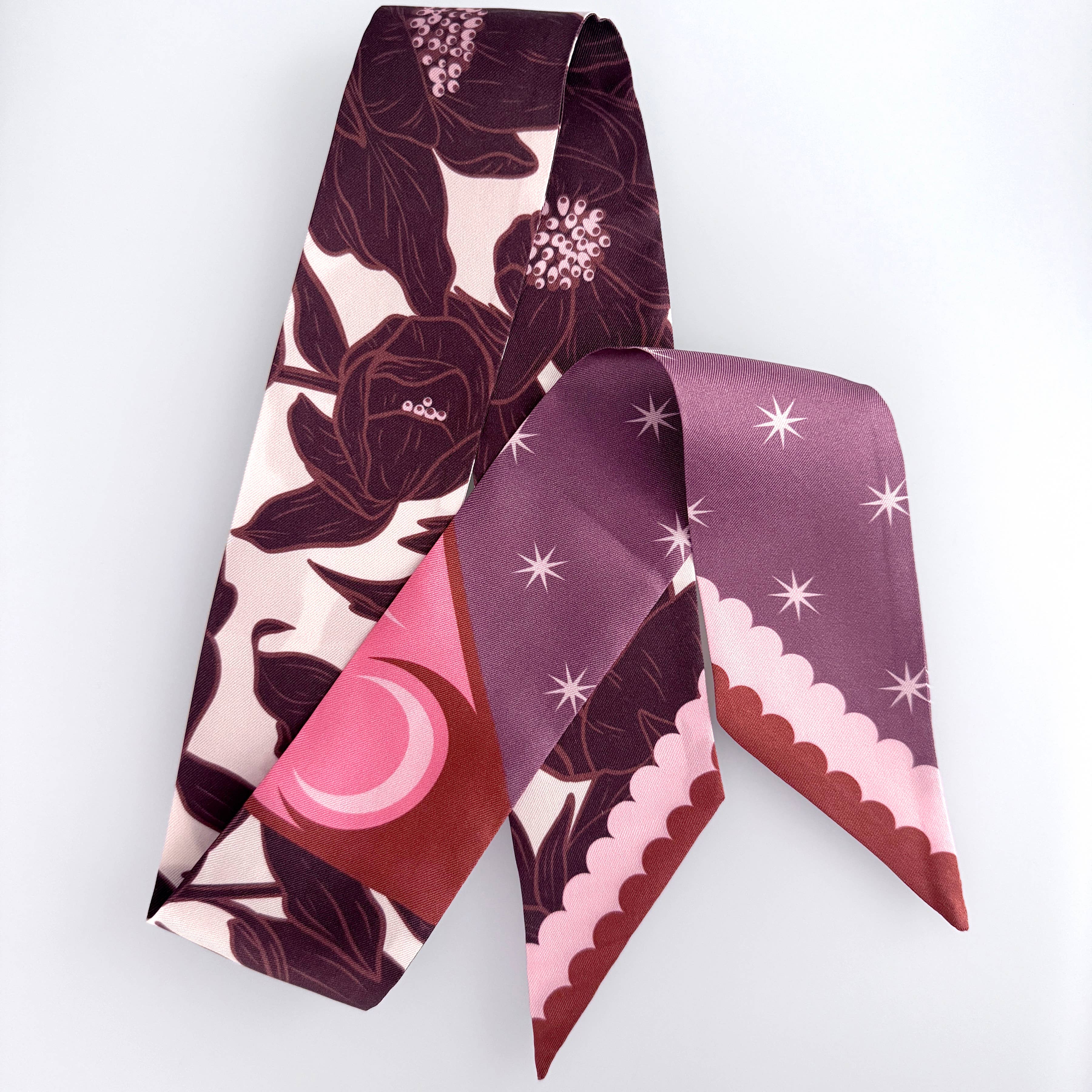 Two patterned scarves on a white background
