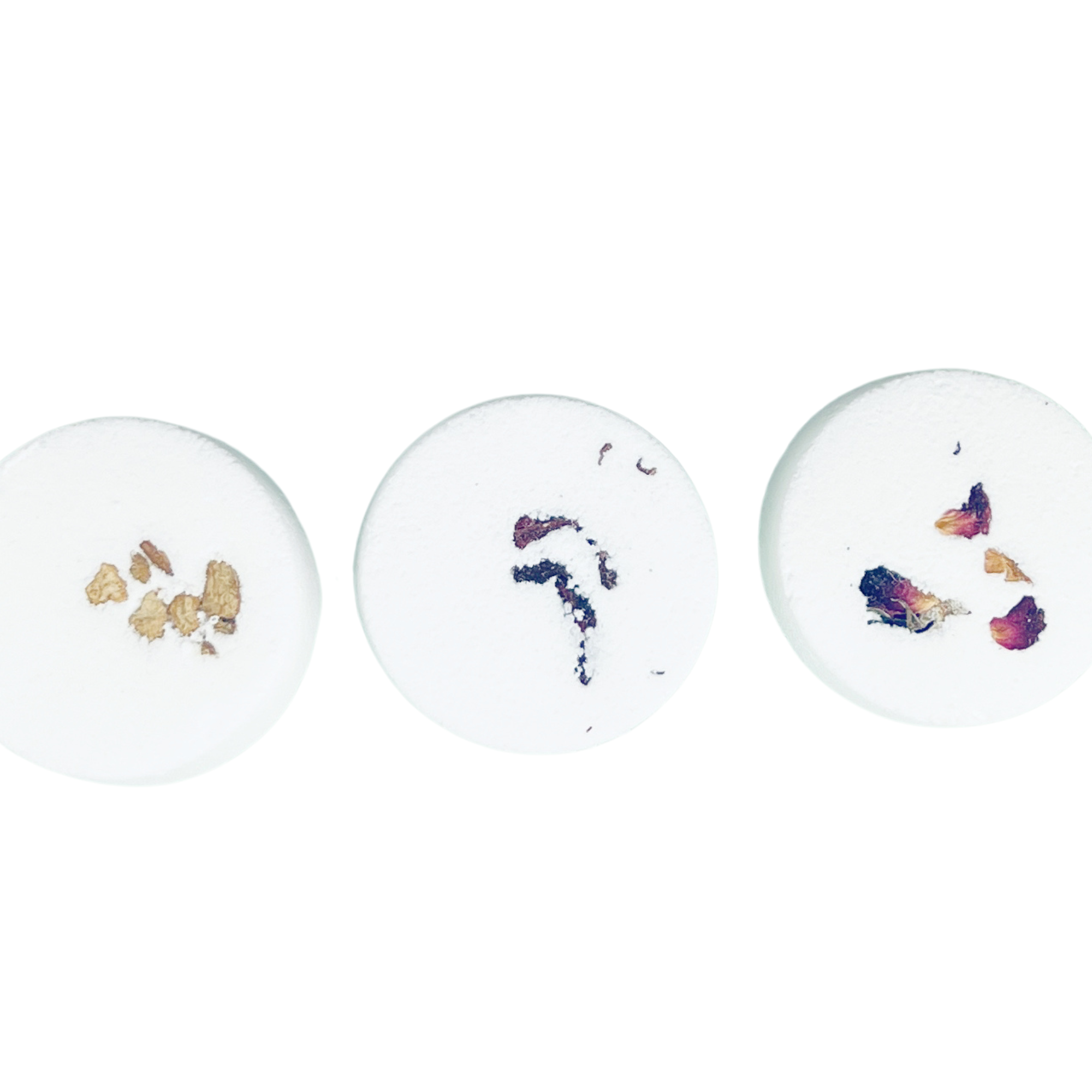 Three round ceramic plates with floral designs on a white background