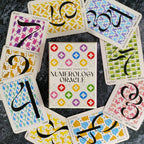 Numerology Oracle cards by Rosemarie Templeton on a dark surface