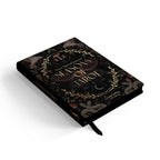 Decorative journal with 'Seasons of Throes' text on a black background