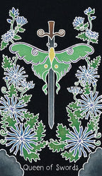 Decorative card with a green butterfly and sword surrounded by flowers on a black background, featuring the text 'Queen of Swords'.