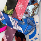Collection of colorful fabric swatches with various patterns.
